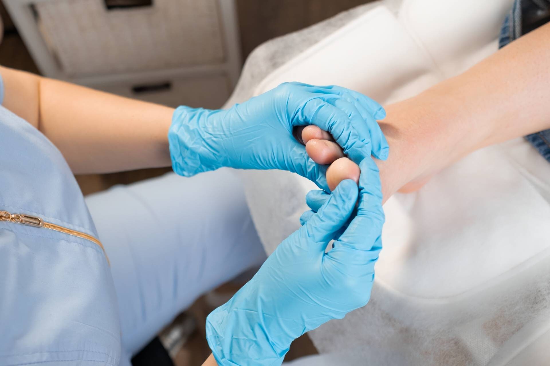 Osteopathy treatment of woman feet at the clinic